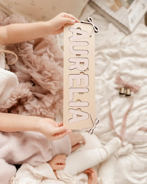 Personalisiertes Steckpuzzle mit Namen und Schleifen - Rosé aus Holz für Kinder ab 3 Jahren mit Gravur